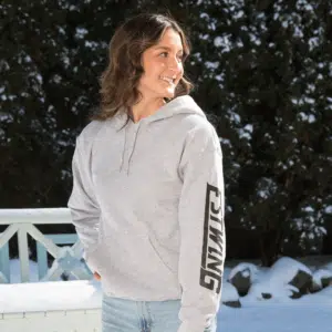 Estwing gray hooded sweatshirt model showing logo on sleeve