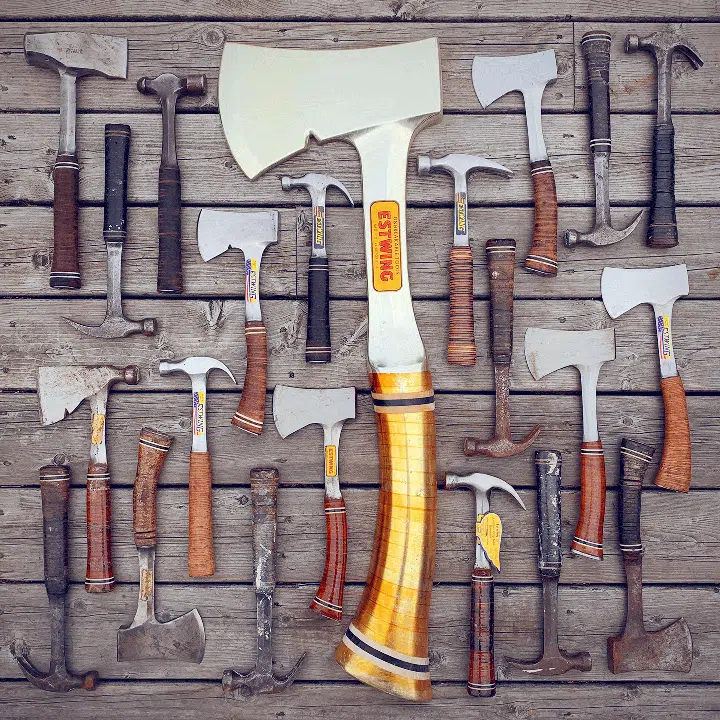 Collection of Estwing hammers and axes with leather handles