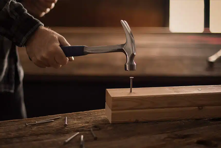 Man Hammering a Nail