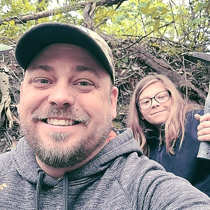 Father and daughter posing for picture during fossil hunt