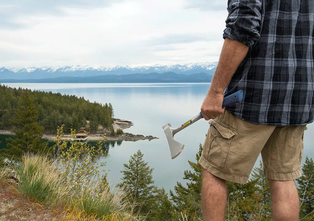 Holding Axe Overlooking Lake