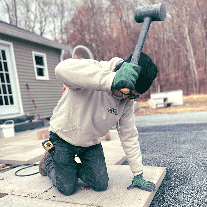 Laying patio pavers with an Estwing deadblow hammer