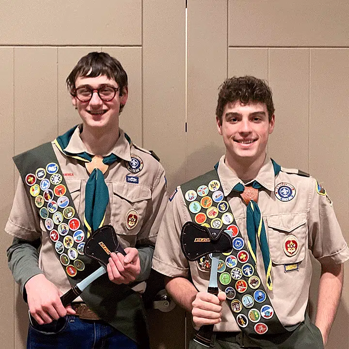 Eagle scouts proudly holding their Estwing Sportsman's Axes